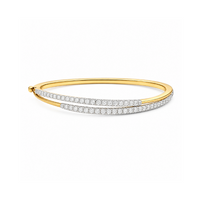 Shiny gold Orbit Double Diamond Bangle bracelet by Appleby Jewellers Dublin featuring embedded diamond accents.