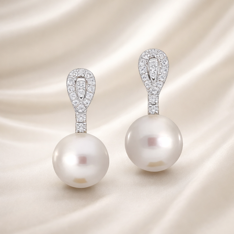 Elegant South Sea pearl and diamond drop earrings by Appleby Jewellers Dublin featuring luxurious design and sparkling accents.
