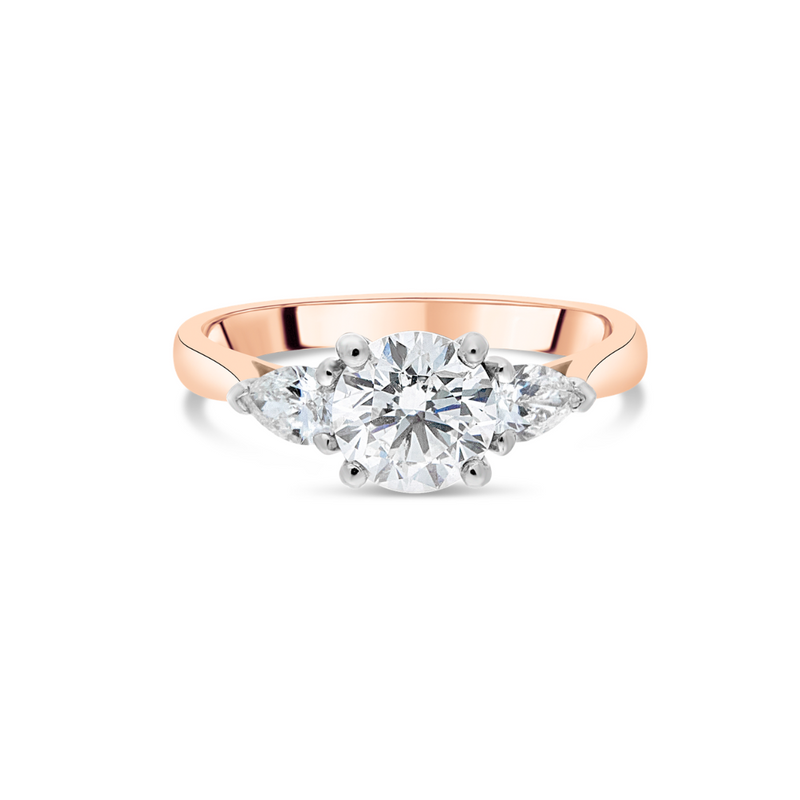 Rose gold ring with a diamond on a white background