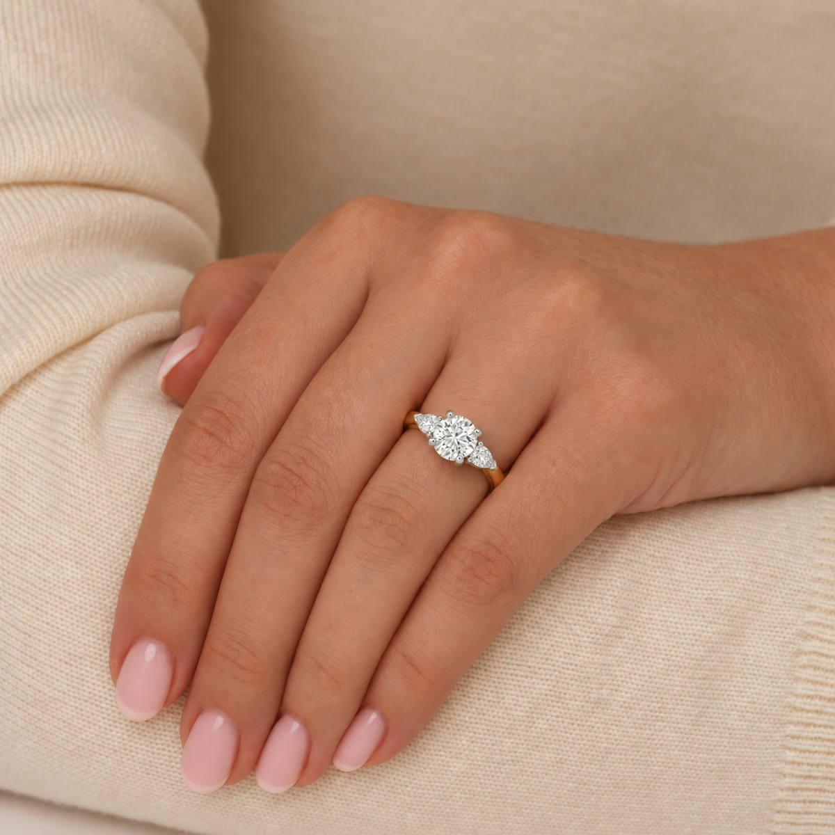 The Tranquility Ring – Round Brilliant with Pear Side Diamonds