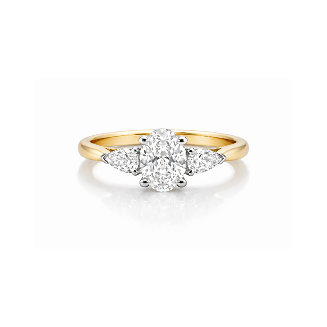Elegant diamond ring featuring a tranquil oval center stone with pear-shaped side accents, crafted by Appleby Jewellers Dublin.