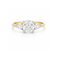 Elegant diamond ring featuring a 1.61ct round brilliant center stone with pear-shaped side diamonds by Appleby Jewellers Dublin.