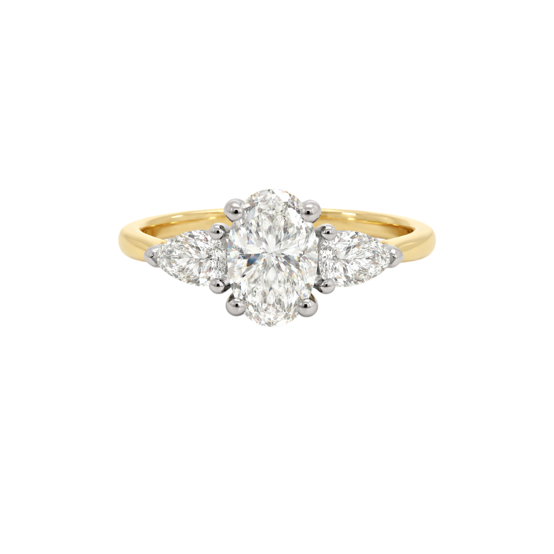Diamond ring with pear-shaped side stones and central round diamond, crafted by Appleby Jewellers Dublin.