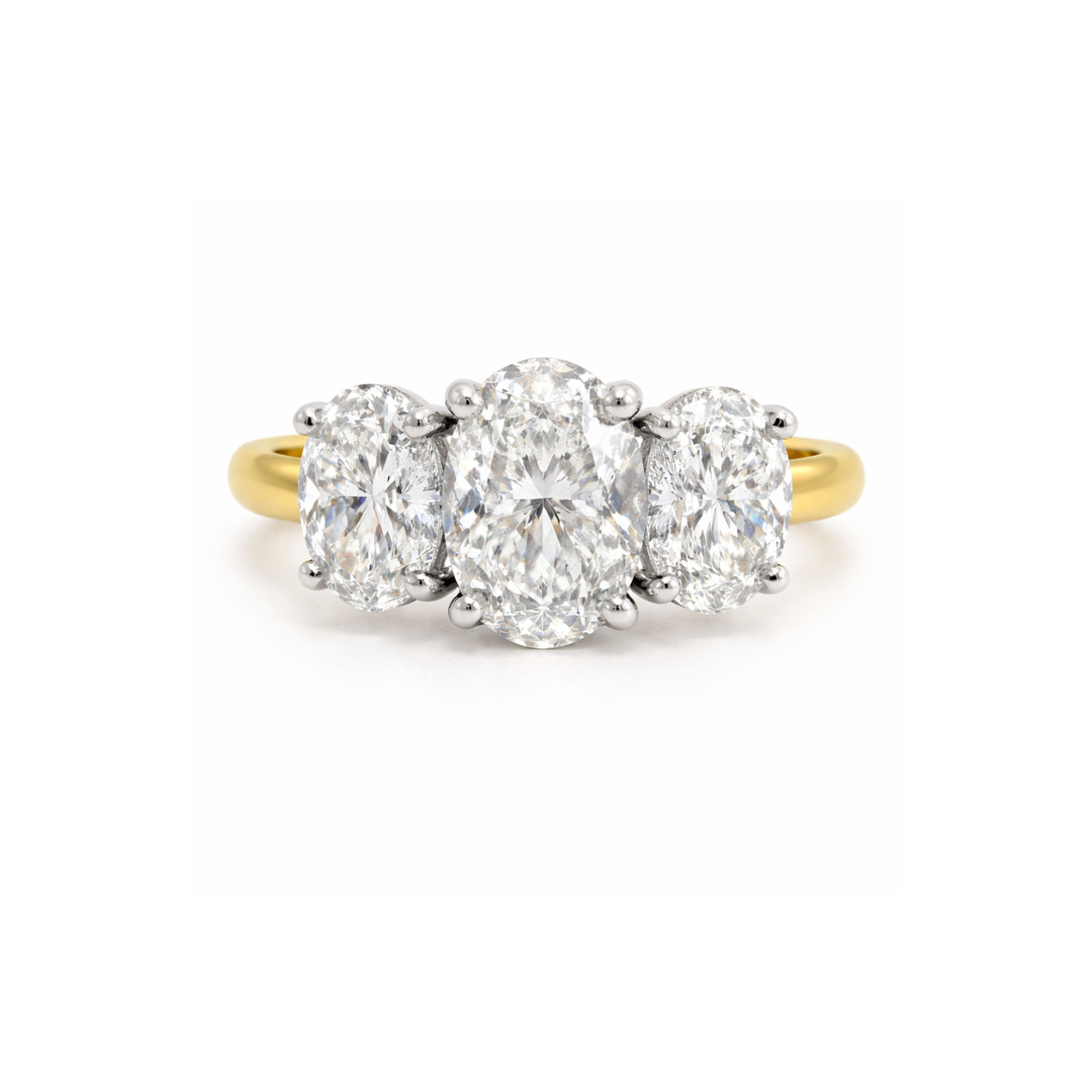 Elegant Trinity Oval Engagement Ring with 3.83ct diamond, crafted by Appleby Jewellers Dublin, showcasing intricate design and sparkling stones.