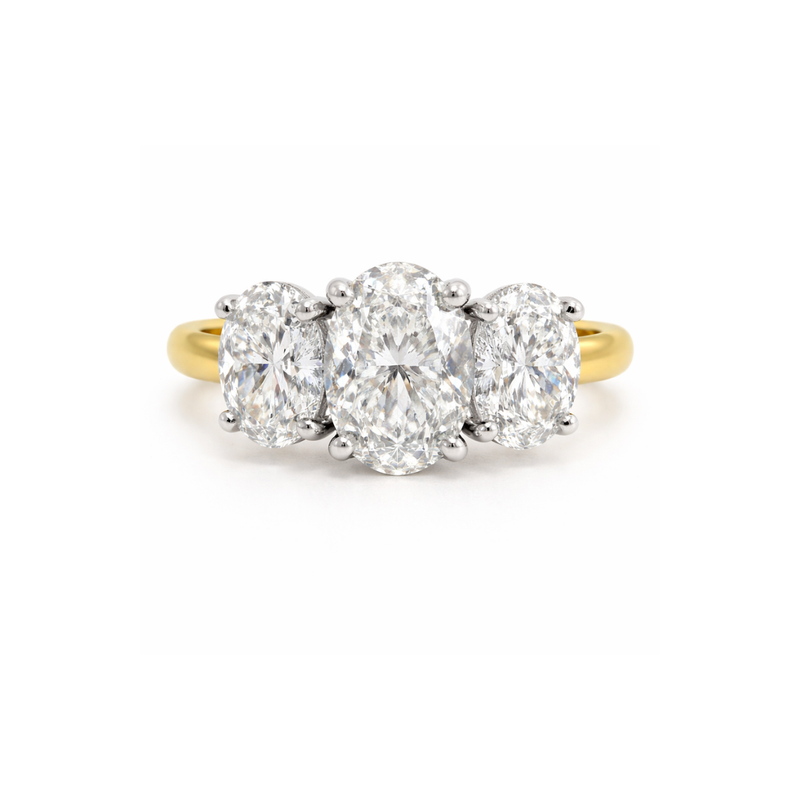 Elegant Trinity Oval Engagement Ring with 3.83ct diamond, crafted by Appleby Jewellers Dublin, showcasing intricate design and sparkling stones.