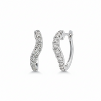 Elegant wave diamond earrings in 18ct white gold featuring sparkling diamonds, designed by Appleby Jewellers Dublin.