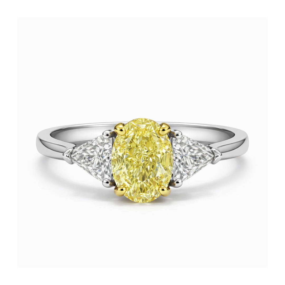 Ring with a yellow diamond and two smaller diamonds on a white background